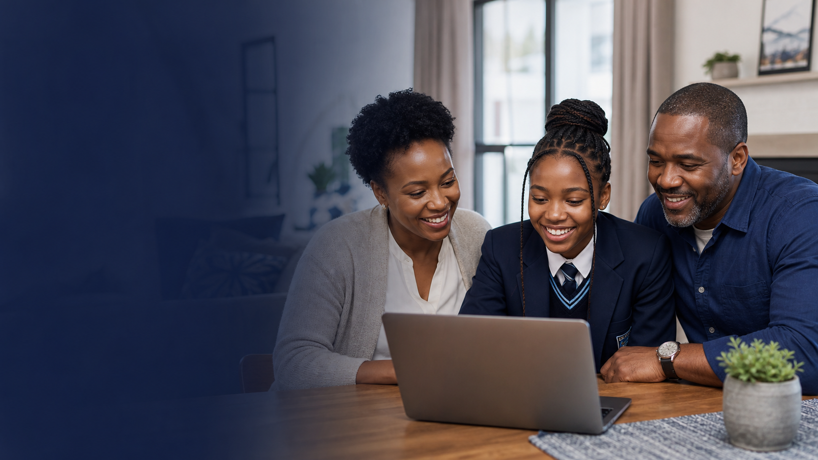 Parents and a HYDA learner using a laptop together at home